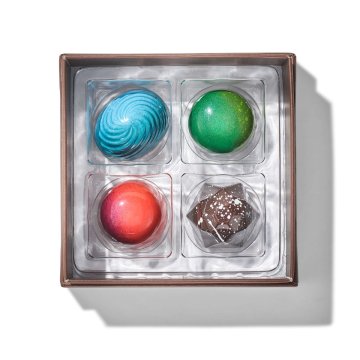 four different chocolate bonbons in Signature 4 Piece Chocolate Collection