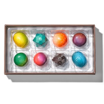 Eight different chocolate bonbons in bright colors